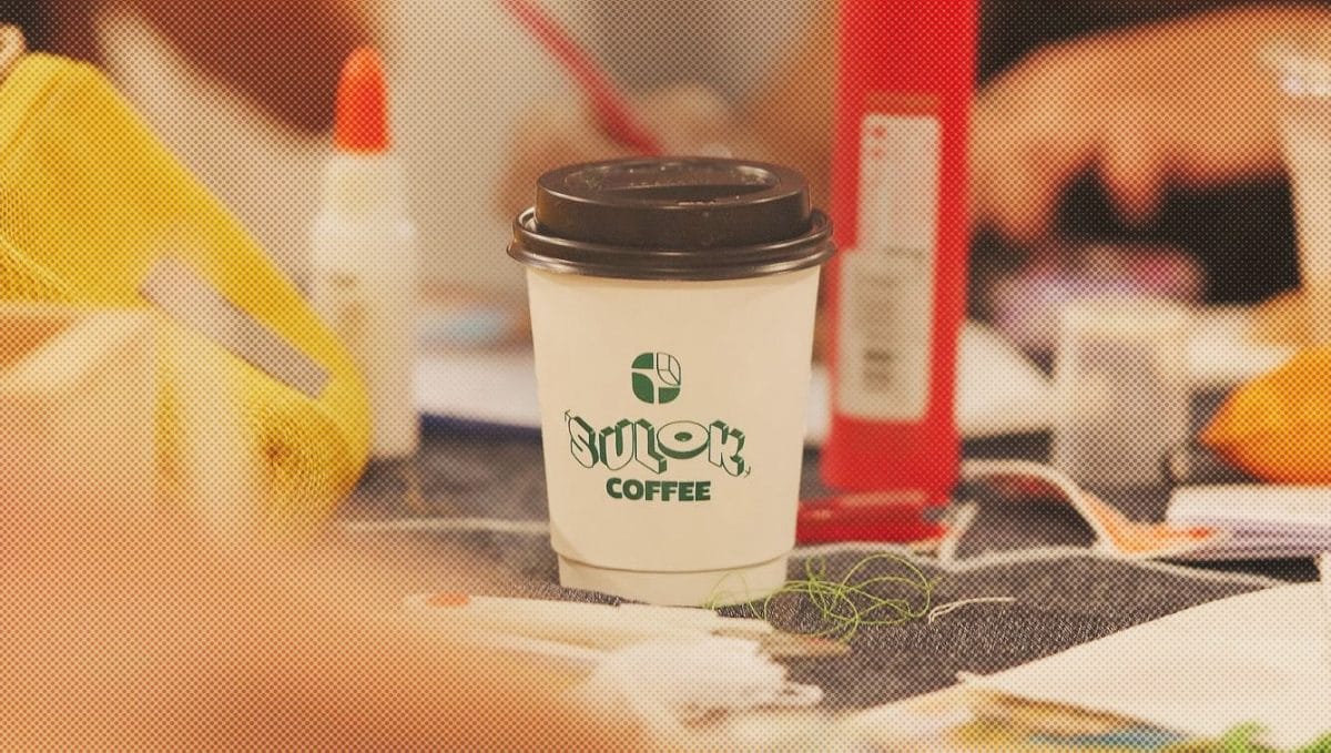 Sulok Coffee branded cup on table